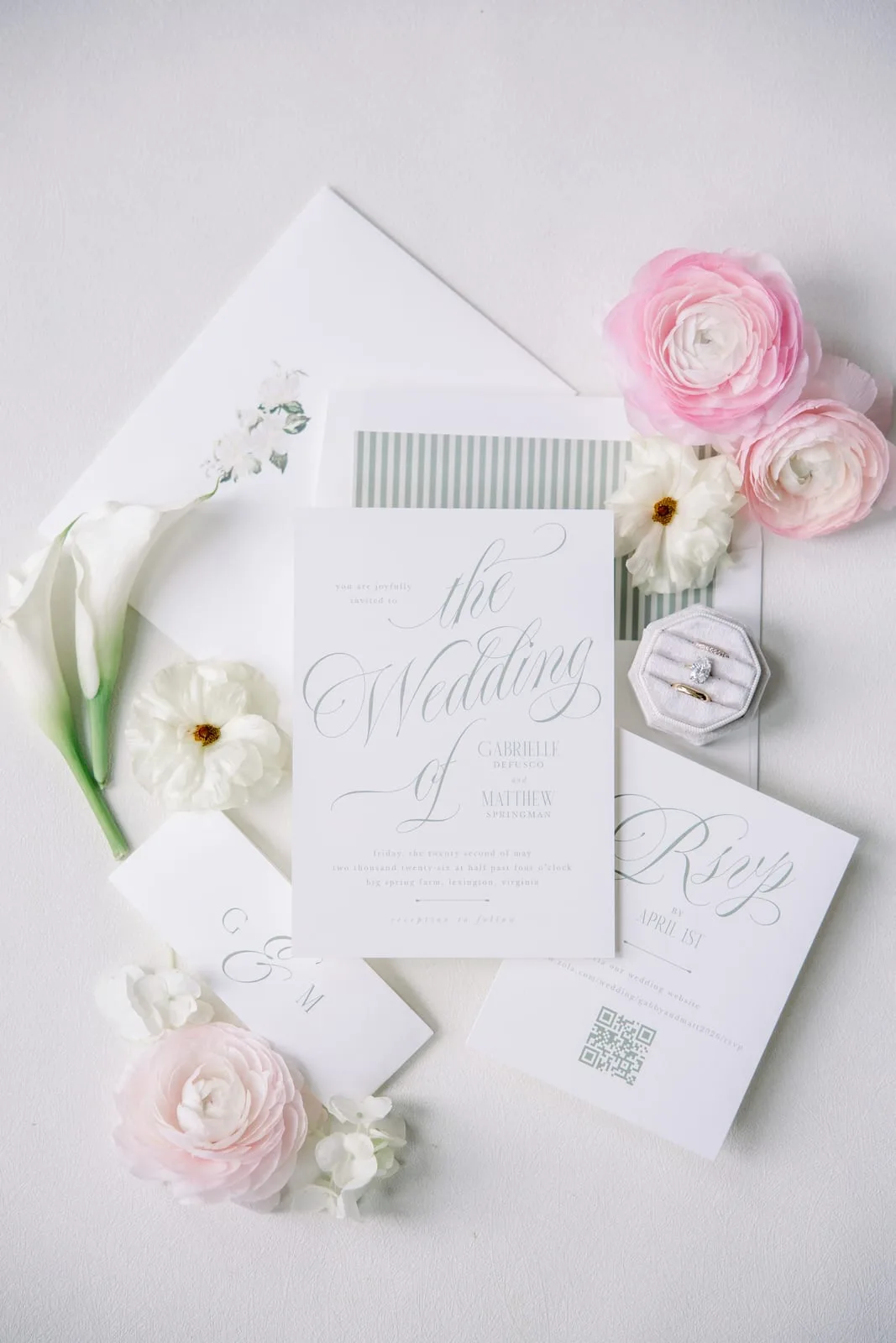 Wedding invitation suite with calligraphy, rings and ranunculus